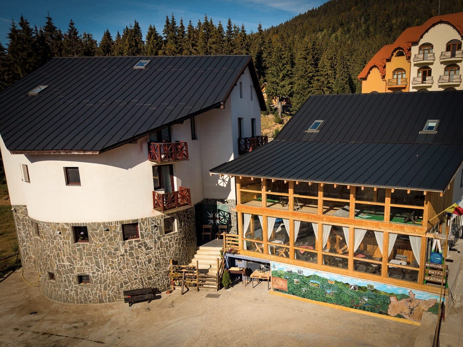 The guesthouse and its terrace from above, seen from the corner