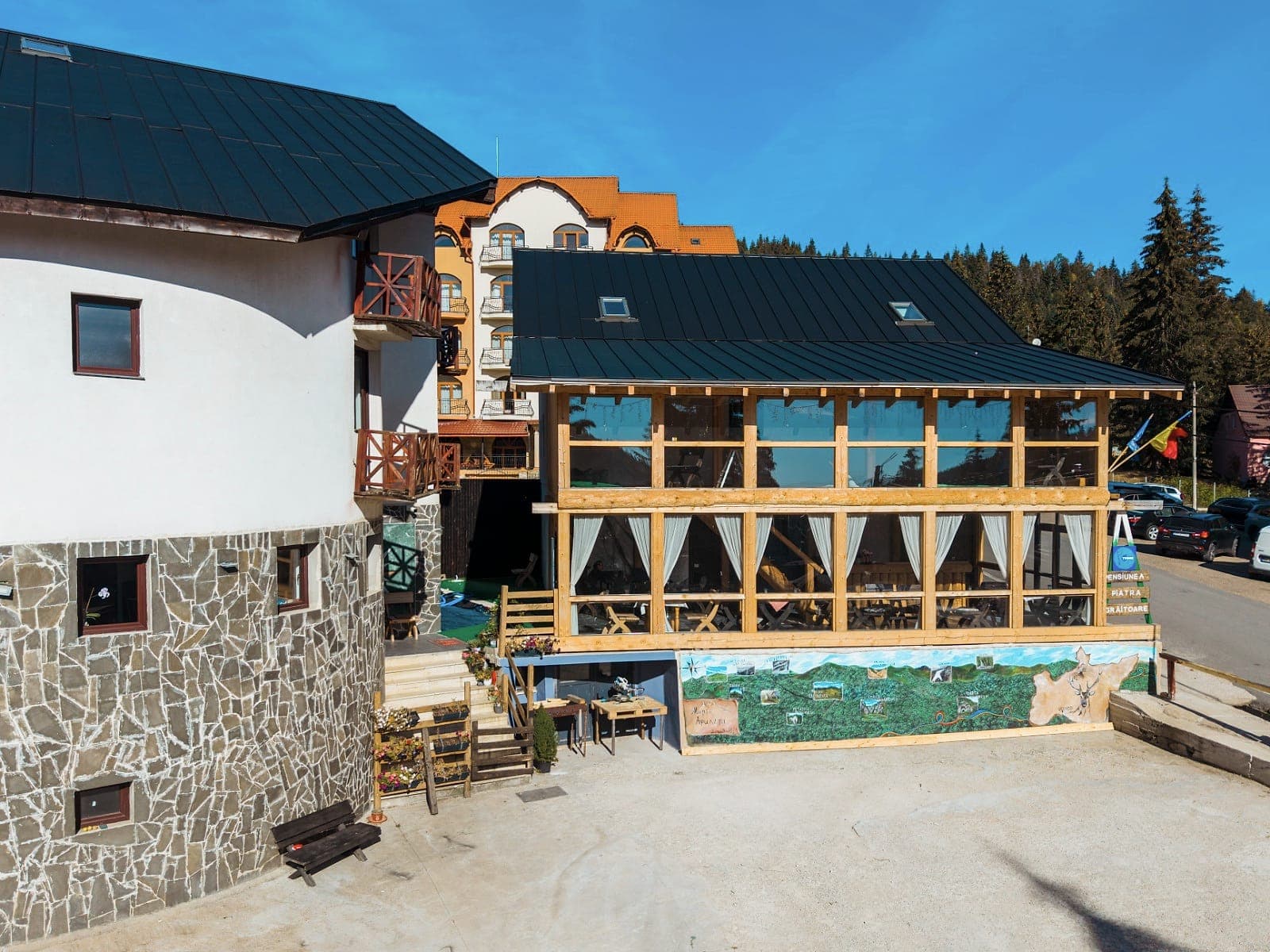 The round stone base of the guesthouse and the terrace, seen from the courtyard